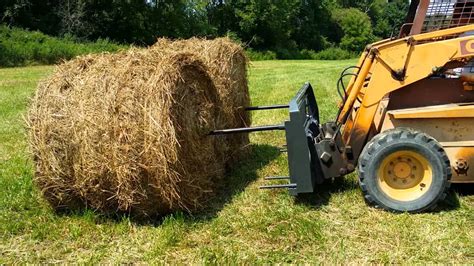 skid steer feeding cows hay|Skid Steer for Hay Operation .